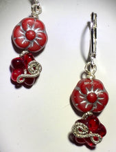 Load image into Gallery viewer, Fine silver wire accents glass beads shaped like flowers in these 1&quot; drop leverback earrings.