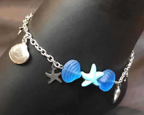 Brilliant blue Czech pressed glass beads shaped like clamshells surround a bright blue pressed glass sea star, accented by delicate stainless steel charms on a sturdy stainless steel chain in this rust-resistant anklet that can stay with you throughout all your adventures.
