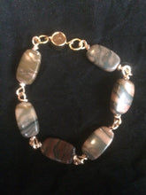 Load image into Gallery viewer, Six 20x11mm rectangular agate beads are connected with hand-wrapped plated copper wire to make this 7.5&quot; bracelet. The clasp is a no-slip magnetic mechanism that offers both security and ease of one-handed operation. It is designed to be a companion piece to matching earrings (Rectangular Swirl Wire Wrapped Agate Earrings - SKU 1EAR0013) and necklace (Rectangular Agate Wire Wrapped Necklace - SKU 1NCK0008) for a matching set.