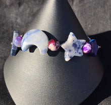 Load image into Gallery viewer, Made from high grade 304 stainless steel, this sturdy corrosion-resistant bracelet features blue sodalite beads in the shapes of moons and stars. Variations: (A) Pink, (B) Blue
