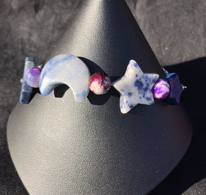 Made from high grade 304 stainless steel, this sturdy corrosion-resistant bracelet features blue sodalite beads in the shapes of moons and stars. Variations: (A) Pink, (B) Blue