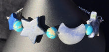 Load image into Gallery viewer, Made from high grade 304 stainless steel, this sturdy corrosion-resistant bracelet features blue sodalite beads in the shapes of moons and stars. Variations: (A) Pink, (B) Blue