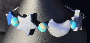 Made from high grade 304 stainless steel, this sturdy corrosion-resistant bracelet features blue sodalite beads in the shapes of moons and stars. Variations: (A) Pink, (B) Blue