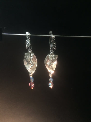 Leverback earrings made with plated metal charms and glass beads (faceted beads and glass pearls)