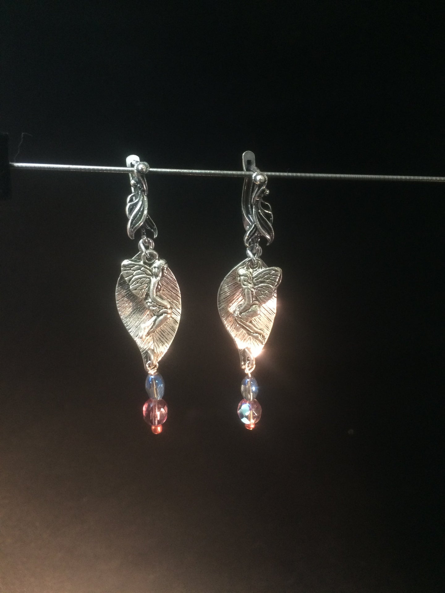 Leverback earrings made with plated metal charms and glass beads (faceted beads and glass pearls)