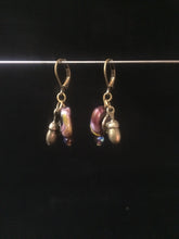 Load image into Gallery viewer, Leverback Earrings made from purple blown glass beads that have swirls and metal acorn charms.åÊ Round glass pearls are added for accent.