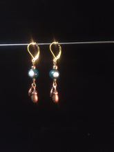 Load image into Gallery viewer, Leverback earrings made from glass beads and metal acorn charms.åÊ The Leverback finding comes in two available tones; a lighter goldish tone and a darker coppery tone.