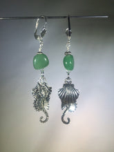 Load image into Gallery viewer, Metal seahorse and scallop shell charms tinkle together as they dangle below a 10mm asymmetric green aventurine bead, all mounted on silver plated brass leverbacks. Variations: (A) Seahorse, (B) Sea Turtle