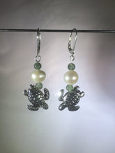 Load image into Gallery viewer, Metal beads shaped like diving sea turtles are accented by aventurine and glass pearl beads in these silver plated brass leverback drop earrings.