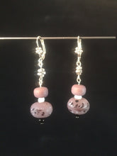 Load image into Gallery viewer, Matte finish lampworked glass beads in a delicate shade of purple form the focus of these 1.5&quot; dangling silver plated brass leverback earrings.