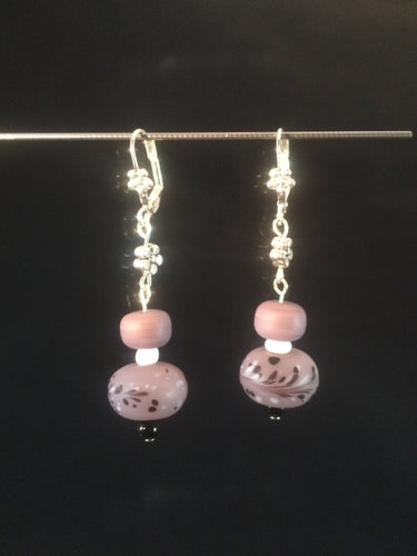 Matte finish lampworked glass beads in a delicate shade of purple form the focus of these 1.5
