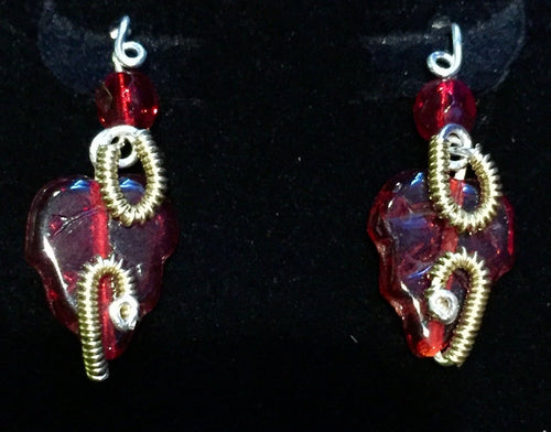 Czech pressed glass leaves are adorned with fine silver wire and 12/20 vermeil coils on this festive pair of post-style pierced earrings. The earring backings are sterling silver.