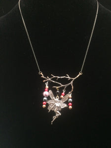 Fairy Flitting Under a Branch with Red Toned Glass Pearls