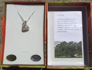 A live oak acorn cap is molded from life out of fine silver, then set on an 18" sterling chain in this necklace, which is part of the "Naturally Coastal" series depicting the flora, fauna, and cultural icons of the US Atlantic coastal ecosystems.