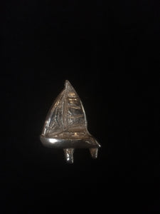 This fine silver pendant is molded to depict a Benetau sloop sailboat. Part of our custom boat portraist series, this piece shows our capability to manufacture a pendant bespoke to a specific vessel. Details are taken from photographs and boat plan drawings. Any vessel can be portrayed--come visit our special section at https://www.kalmansoncreations.com/boats on our independent website for more information!