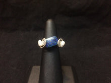 Load image into Gallery viewer, A 12x8mm natural chrysocolla bead is set with two textured swirls and two freshwater seed pearls as accents in this sterling silver wire wrapped ring. The wire wrapped rings made via this method vary individually. This one is approximately a size 6.5.