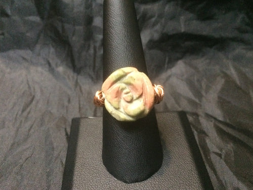 17mm carved unakite flower on a U-shaped silver plated copper shank