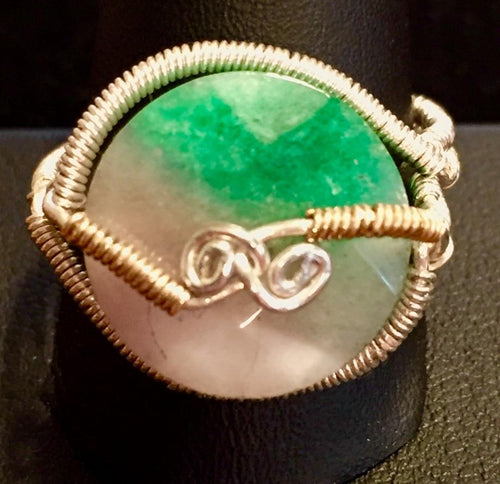 Fine silver and vermeil (14K gold plating over sterling silver) wire ensconce a faceted lentil shaped bead of natural watermelon tourmaline. Rings made by this wire wrapping method vary individually. This one is approxmately a size 11, but may fit a slightly larger finger depending on how snug a fit you prefer.