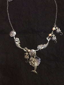 Mermaids Dancing with a Pearl