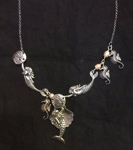 Mermaids Dancing with a Pearl